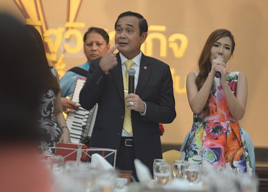 'Such a foul mouth,' PM Prayuth Chan-ocha says while jokingly pointing to his mouth as he sang the verse from a pop song with reporters at Government House.