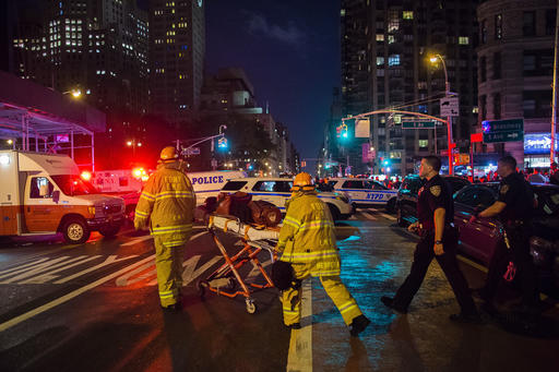 Police and firefighters work near the scene of an apparent explosion on Saturday in Manhattan's Chelsea neighborhood, in New York. Photo: Andres Kudacki / Associated Press