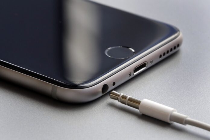 An earphone jack and charging port on an Apple iPhone 6 on Sept. 2 in New York. Apple is getting ready to unveil new iPhones on Sept. 7. Photo: Richard Drew / Associated Press