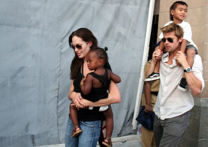 American actress and UNHCR Ambassador Angelina Jolie, left, with her daughter Zahara, and Brad Pitt, right, with Jolie's son Maddox, walk near the Gateway of India in 2006 in Mumbai, India. Photo: Associated Press