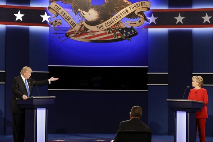 Republican presidential nominee Donald Trump gestures toward Democratic presidential nominee Hillary Clinton during the presidential debate on Monday at Hofstra University in Hempstead, New York. Photo: David Goldman / Associated Press
