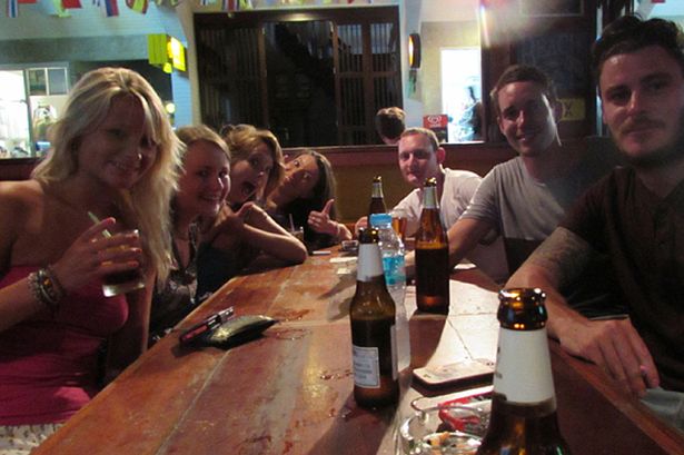 Hannah Witheridge, at left, and David Miller, second from right, pose for a photo posted to facebook just hours before their murders on Sept. 15, 2014. Photo: Facebook