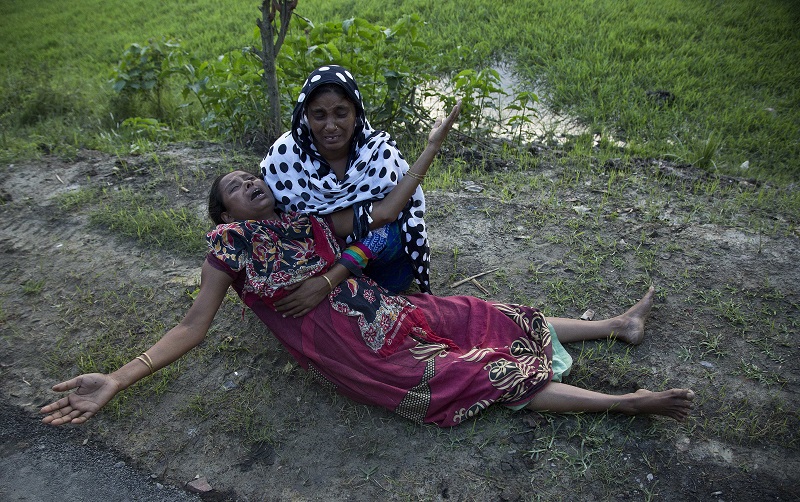 Mazida Beghum, 40, mother of Anjuma Beghum, 18, who was killed on Monday in police firing wails at Bandardubi village on the periphery of the Kaziranga National Park, northeastern Assam state, India. Photo: Anupam Nath / Associated Press