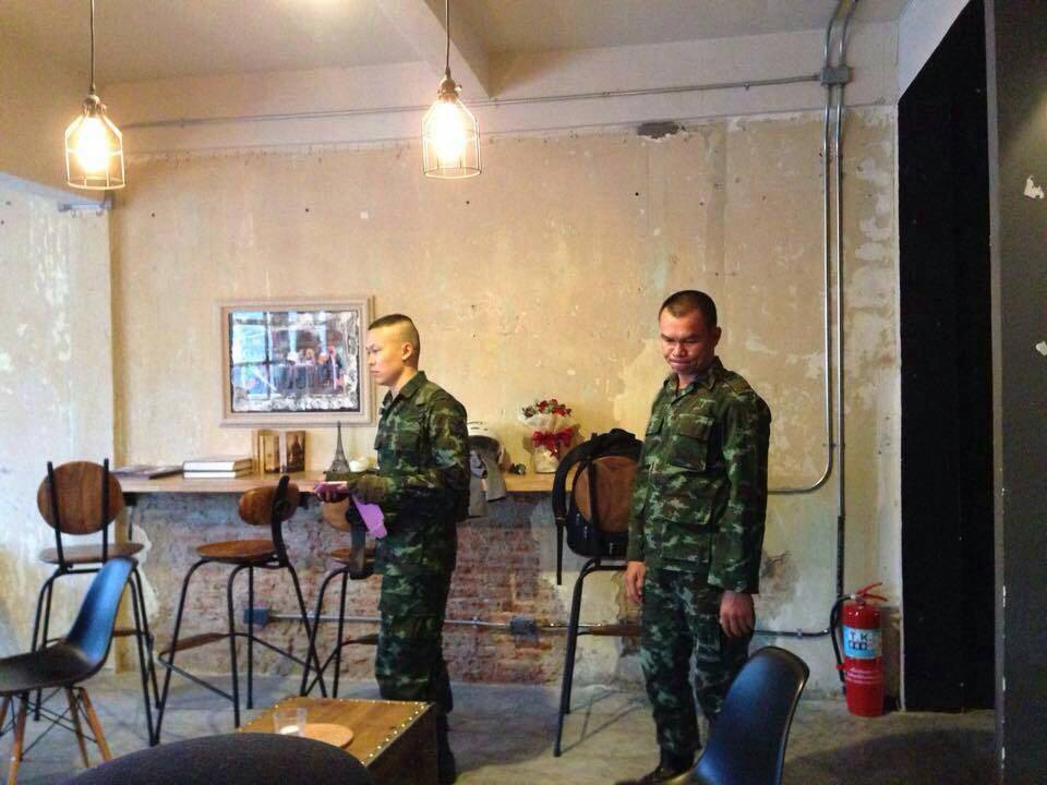 Two military officers at Thong Lor Art Space in January 2015 for ‘Bang La Merd.’ Photo: B-Floor / Facebook 