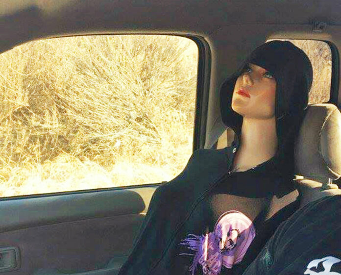 This Wednesday, Sept. 21, 2016 photo provided by the Brea, Calif., Police Department shows a mannequin in the passenger seat of a truck that the driver was using to use the carpool lane instead of congested regular traffic lanes on the 57 Freeway in Brea. The driver was cited, and admitted to using the mannequin to use the carpool lane for some time, and said he would now just accept the fact he needs to sit in traffic like everyone else. Driving alone in the carpool lane requires a fine of at least $481. (Brea Police Department via AP)