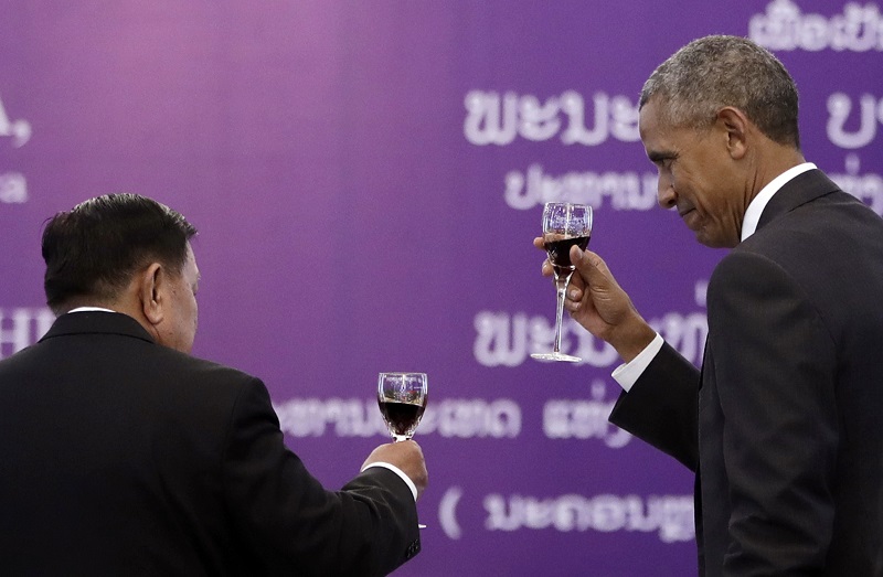 Laotian President Bounnhang Vorachit, left, and U.S. President Barack Obama toast during an official state luncheon Tuesday at the Presidential Palace in Vientiane, Laos. Photo: Carolyn Kaster / Associated Press