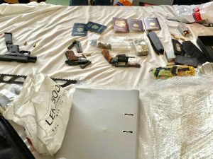 Passports, guns, marijuana and crystal meth found by police Friday on the fourth floor of a building in Bangkok’s Phra Khanong area.