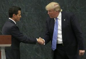 Mexico President Enrique Pena Nieto and Republican presidential nominee Donald Trump shake hands on Wednesday after a joint statement at the presidential official residence in Mexico City. Photo: Marco Ugarte / Associated Press