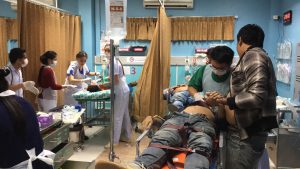 Injured policemen and civilians receive emergency care after two cops opened fire in a Koh Samui pub early Friday morning. 