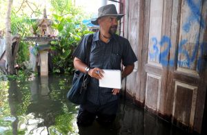 Ghosh in the field reporting on severe flooding in Thailand in 2011. Photo: Nirmal Ghosh / Courtesy