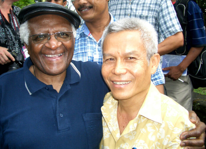 Sombath Somphone, seen here in 2006 with Desmond Tutu, is a respected community development worker from Laos abducted in Vientiane on Dec. 15, 2012. Photo: Shui-Meng Ng