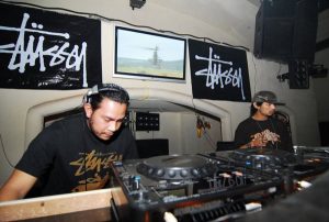 2006: A younger DJ Dragon at left in bliss over the deck at 'Camouflage' at Club Astra. Stussy even sponsored the thing.