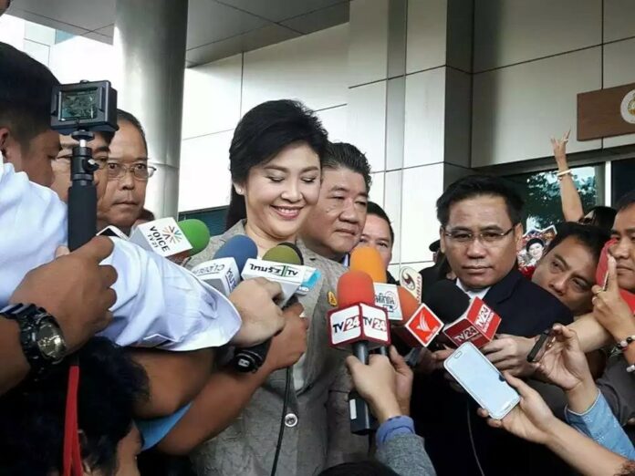 Former PM Yingluck Shinawatra speaks to reporters on Sept. 9 outside the Supreme Court. Photo: Matichon