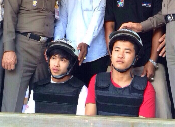 Wai Phyo, at left, and Zaw Lin are paraded in front of the media on Oct. 3, 2014, shortly after their arrest on Koh Tao. 