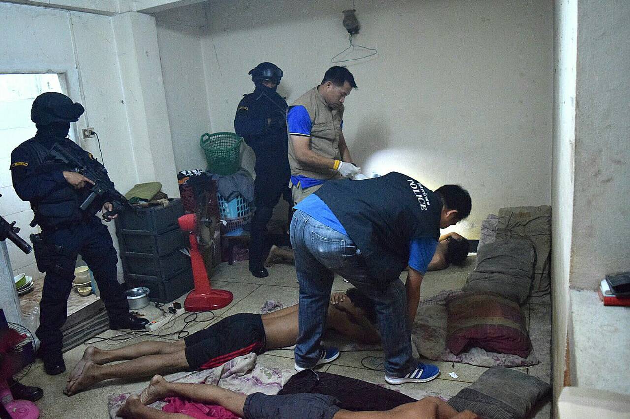 Police commandos raid a building Monday in Bangkok as part of a counterterrorism operation.