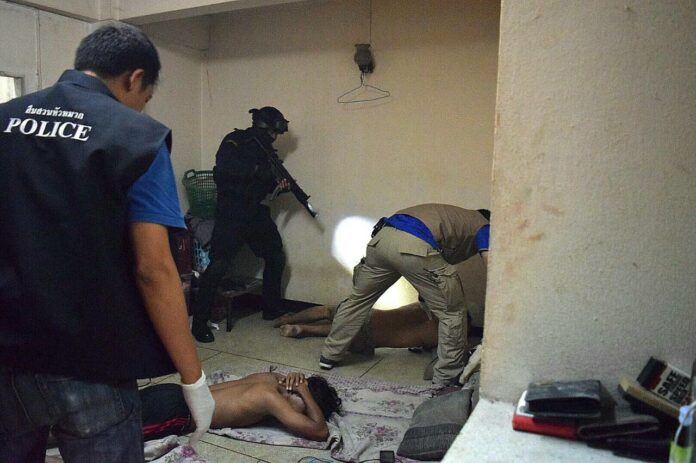 Police commandos on Monday raid a building in Bangkok as part of a counterterrorism operation.