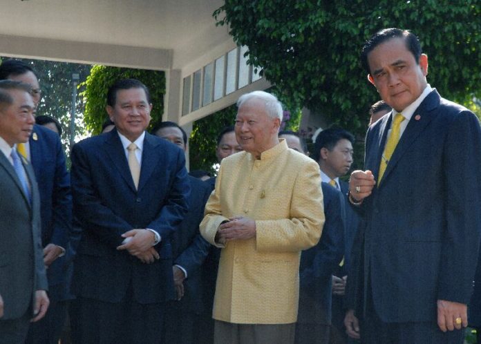 Gen. Prem Tinsulanonda, in yellow, meets with the junta leaders at his residence Dec. 30 in Bangkok.