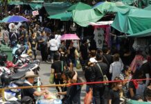 Roads to Avoid As Bangkok Flocks to Buy Black (Photos)