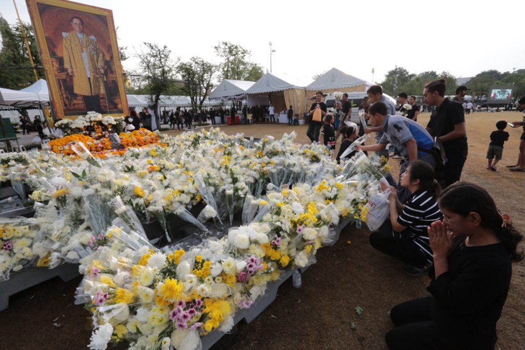 Flowers left by mourners at Sanam Luang on Tuesday