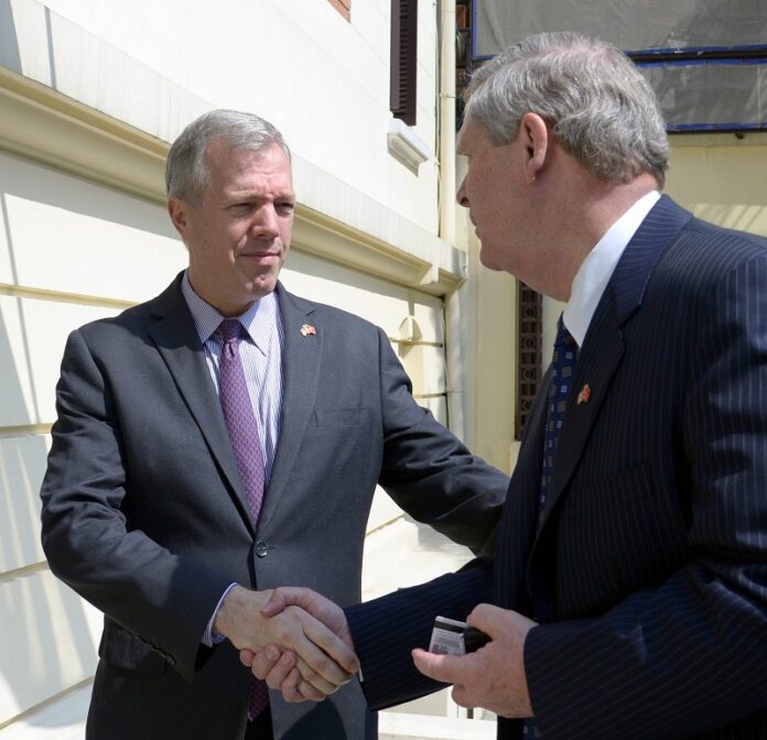 U.S. Ambassador to Vietnam Ted Osius greets Agriculture Secretary Tom Vilsack last April at the U.S. Embassy in Hanoi, Vietnam. Photo: U.S. Department of Agriculture / Flickr