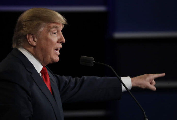 Republican presidential nominee Donald Trump points to Democratic presidential nominee Hillary Clinton during the third presidential debate in October in Las Vegas, Nevada. Photo: Patrick Semansky / Associated Press