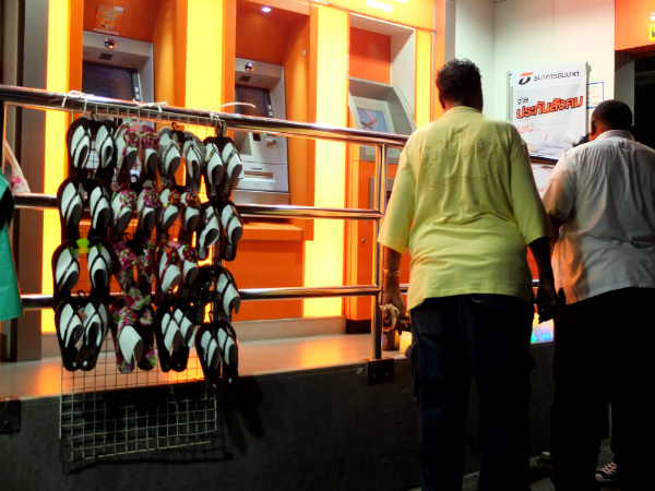 Sandals were hung on the railing of a bank branch on Sukhumvit Road on Wednesday night by Pornthipa Boonmart, 49.