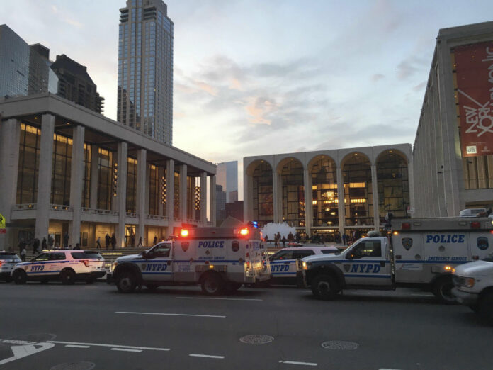 Police respond to New York's Metropolitan Opera which halted a performance after someone sprinkled an unknown powder into the orchestra pit, Saturday, Oct. 29, 2016. Photo: Dylan Hayden (AP)