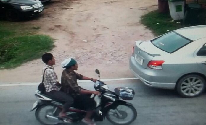 A captured image from the security camera footage shows the moment when two men on motorcycle open fire on the two teachers Friday in Pattani province.