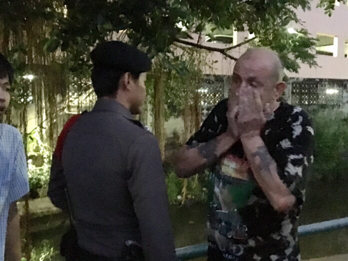 Daniells reacts at the scene of a 22-year-old Ugandan woman’s suicide this morning at a condo in Bangkok’s Rat Burana district.