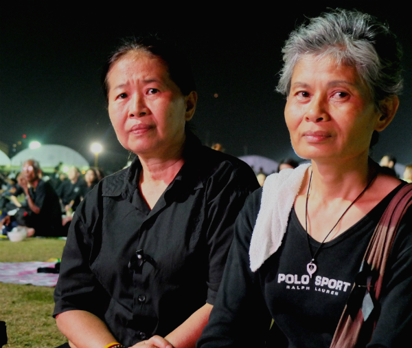 Bangkok resident Jintana Chanakul, at left, and her friend Wilai Khramjapo from Chiang Mai province at the Sanam Luang.