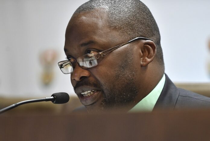 South Africa's minister of justice and correctional services, Michael Masutha, speaks to the press Friday in Pretoria, South Africa. Photo: Associated Press