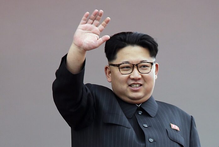 North Korean leader Kim Jong Un waves at parade participants in 2016 at the Kim Il Sung Square in Pyongyang, North Korea. Photo: Wong Maye-E / Associated Press