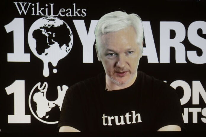 WikiLeaks founder Julian Assange participates via video link at a news conference marking the 10th anniversary of the secrecy-spilling group on Oct. 4 in Berlin. Photo: Markus Schreiber / Associated Press