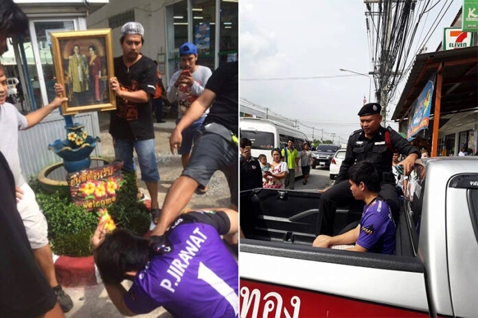 Jirawat Pathumthong is kicked to the ground before a portrait of His Majesty the Late King on Tuesday in Chonburi province.