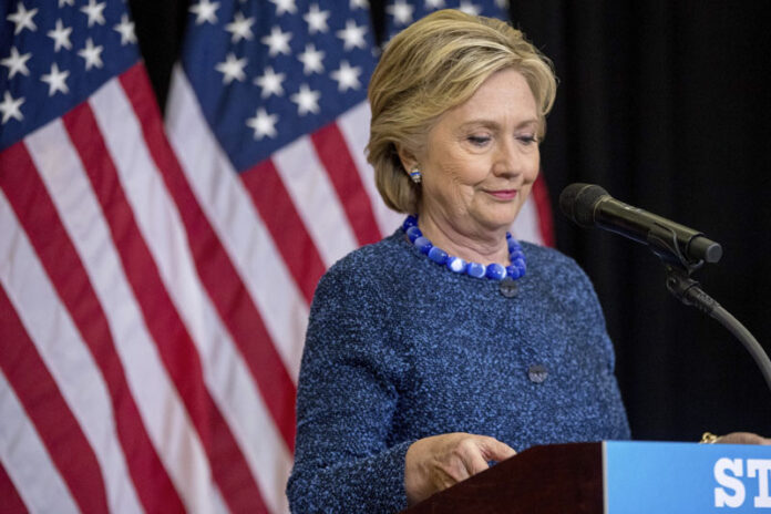 Democratic presidential candidate Hillary Clinton pauses while speaking Friday at a high school in Des Moines, Iowa. Photo: Andrew Harnik / Associated Press