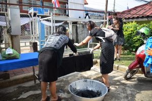 Clothes are dyed Tuesday morning at vocational education offices in Loei.