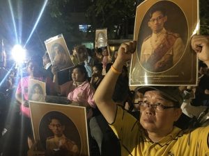 People mourn the passage of King Bhumibol Adulyadej outside Siriraj Hospital on Thursday in Bangkok.