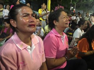  'I will sit right here until he walks down,' Malee Siriphan, 51 of Bangkok, said through tears Thursday evening.