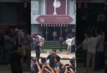 Mob Demands Woman Accused of Royal Defamation Kneel Before Portrait