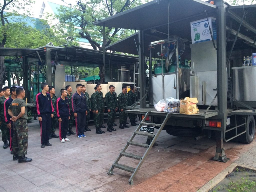 The Royal Thai Army provides free meals Monday at Sanam Luang in Bangkok. 