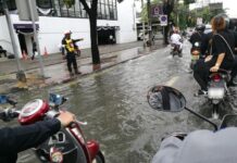 The Wetness: Tuesday Morning More Hustle Than Bustle as Streets Flood
