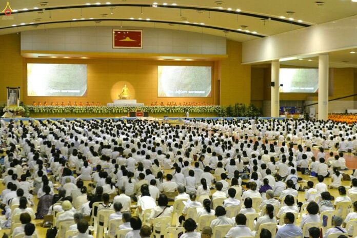 Thousands of Buddhists gather for a Wednesday prayer session at Wat Dhammakaya in the suburbs of northern metro Bangkok.