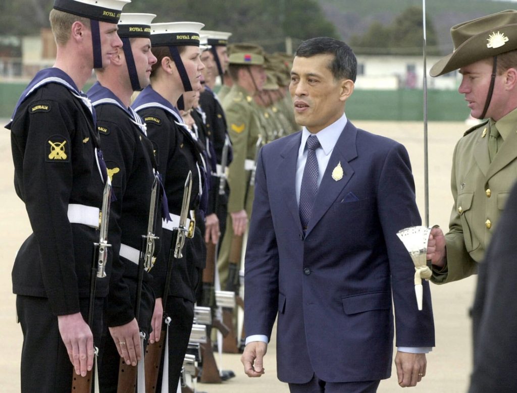 This file photo taken on August 21, 2003 shows Crown Prince Maha Vajiralongkorn (C) of Thailand inspecting the guard of honour upon his arrival in Canberra. / AFP PHOTO / NEWS LTD / JOHN FEDER / Austria OUT