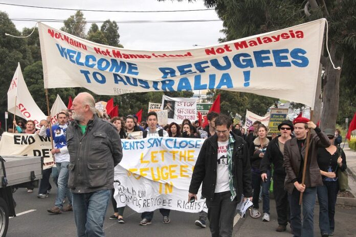 People rally in 2013 outside the Broadmeadows Melbourne Immigration Transit Accommodation (MITA) Centre, advocating for the acceptance of refugees in Melbourne, Australia. Photo: Takver / Flickr