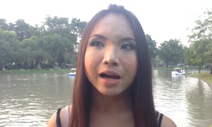 Saran Chuichai, aka Aum Neko, speaks to a reporter on Dec. 8, 2013, in Bangkok. Image: Fah SK / YouTube