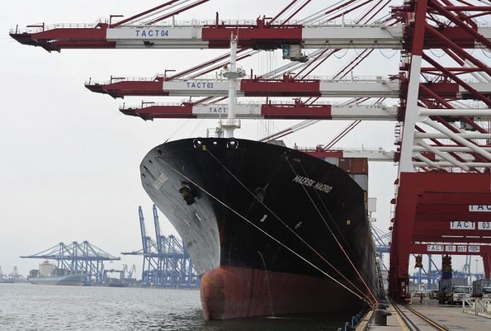 Containers are loaded onto a cargo ship in 2010 at the Tianjin port in China. Photo: Andy Wong / Associated Press