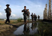 Insurgents Attack Myanmar Soldiers in Rakhine Myanmar police officers patrol the border fence between Myanmar and Bangladesh on Oct. 14, 2016, in Maungdaw, Rakhine State, Myanmar. Photo: Thein Zaw / Associated Press