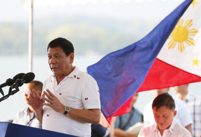 Philippine President Rodrigo Duterte addresses the crowd Wednesday during his visit to Sual township, Pangasinan province in northern Philippines. Photo: Bullit Marquez / Associated Press