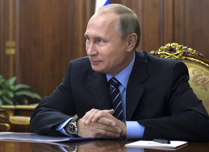 Russian President Vladimir Putin meets with Russian Transport Minister Maxim Sokolov in 2016 in the Kremlin in Moscow, Russia. Photo: Alexei Druzhinin / Associated Press