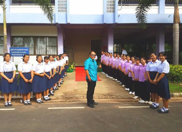 Nangrong School’s director, at center, and students in August at the Buriram province school. Photo: Nangrong School / Facebook